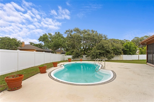 9311 136th Way, Seminole, FL 33776 - view of swimming pool featuring a patio, a fenced backyard, and a sunroom