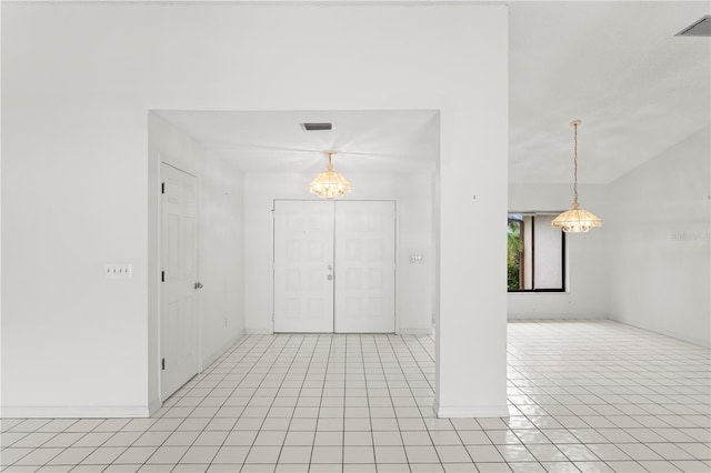 9311 136th Way, Seminole, FL 33776 - foyer entrance featuring a chandelier and light tile patterned floors