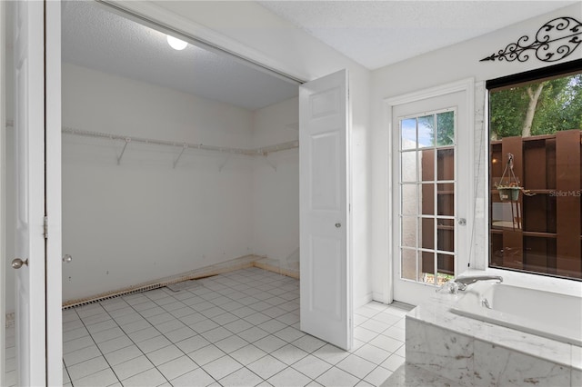 9311 136th Way, Seminole, FL 33776 - walk in closet featuring light tile patterned floors