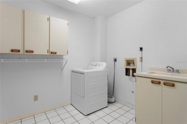 9311 136th Way, Seminole, FL 33776 - laundry room featuring washer / clothes dryer, cabinet space, a textured ceiling, and light tile patterned floors