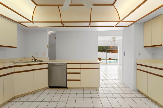 9311 136th Way, Seminole, FL 33776 - kitchen featuring dishwasher, light countertops, cream cabinetry, and a peninsula