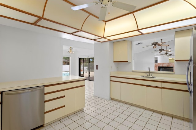 9311 136th Way, Seminole, FL 33776 - kitchen featuring stainless steel appliances, ceiling fan, light countertops, and cream cabinets