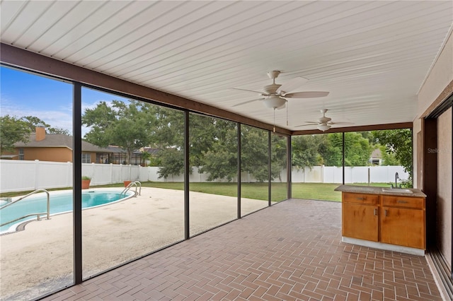 9311 136th Way, Seminole, FL 33776 - unfurnished sunroom featuring ceiling fan