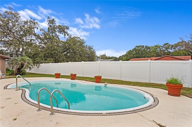 9311 136th Way, Seminole, FL 33776 - view of swimming pool featuring a fenced backyard and a patio area