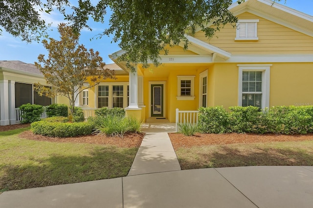 221 Sunset Crest Ct, Apollo Beach, FL 33572 - view of front of home featuring a porch and stucco siding