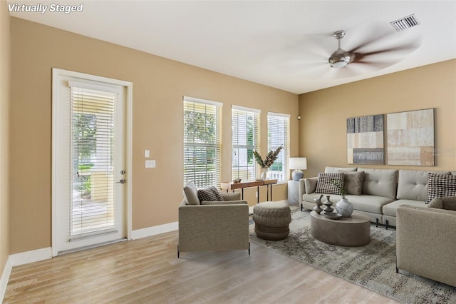 221 Sunset Crest Ct, Apollo Beach, FL 33572 - living area featuring light wood-style flooring and ceiling fan