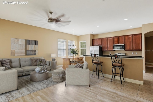 221 Sunset Crest Ct, Apollo Beach, FL 33572 - living area with a ceiling fan, recessed lighting, and light wood finished floors