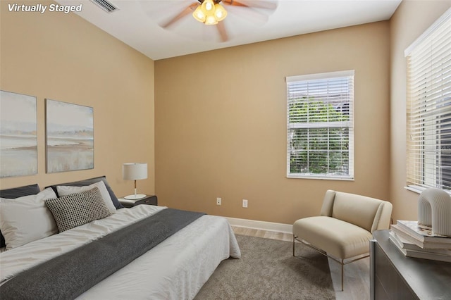 221 Sunset Crest Ct, Apollo Beach, FL 33572 - bedroom with wood finished floors and ceiling fan