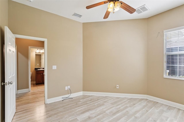 221 Sunset Crest Ct, Apollo Beach, FL 33572 - empty room with light wood-style floors, ceiling fan, and healthy amount of natural light