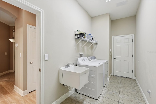 221 Sunset Crest Ct, Apollo Beach, FL 33572 - laundry area featuring independent washer and dryer and baseboards