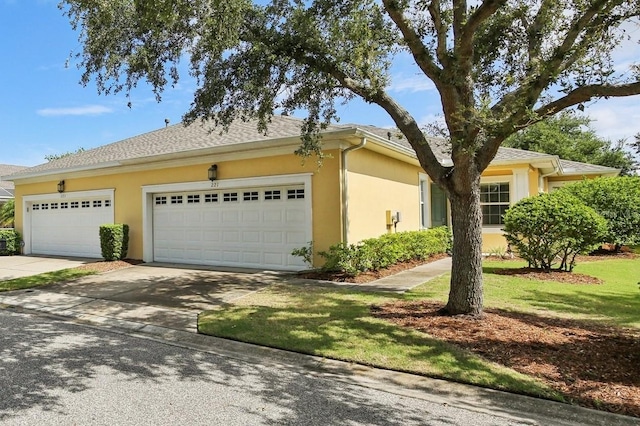 221 Sunset Crest Ct, Apollo Beach, FL 33572 - view of home's exterior featuring concrete driveway, a garage, and stucco siding