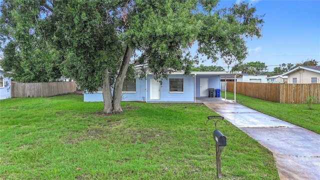 6228 Florida Cir W, Apollo Beach, FL 33572 - bungalow-style home with driveway and a carport