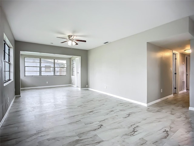 6228 Florida Cir W, Apollo Beach, FL 33572 - empty room featuring a ceiling fan and marble finish floors