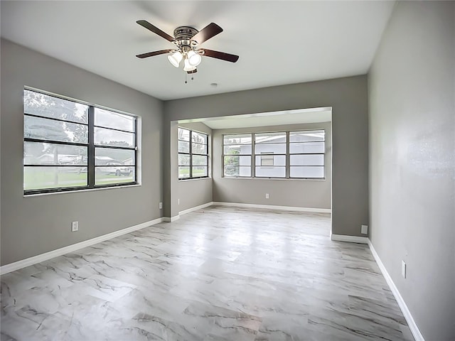 6228 Florida Cir W, Apollo Beach, FL 33572 - spare room with ceiling fan and light marble finish flooring