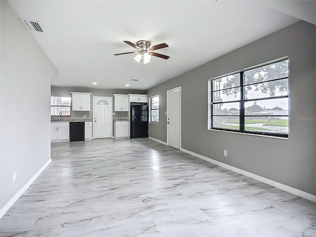 6228 Florida Cir W, Apollo Beach, FL 33572 - unfurnished living room with a ceiling fan, light marble finish floors, and recessed lighting