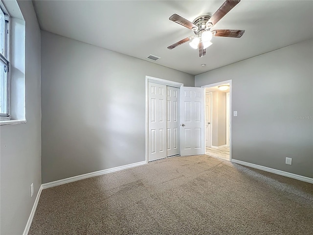 6228 Florida Cir W, Apollo Beach, FL 33572 - unfurnished bedroom featuring carpet floors, a closet, and ceiling fan