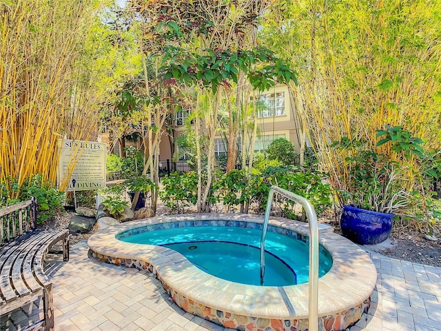 501 S Moody Ave Unit 1130, Tampa, FL 33609 - view of pool with a community hot tub and a swimming pool