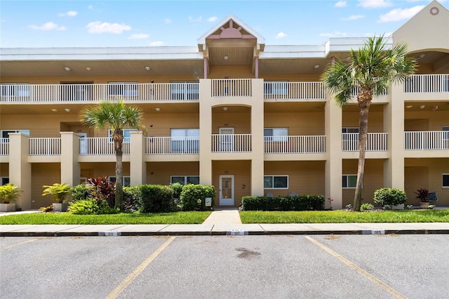 2231 Utopian Dr E Unit 307, Clearwater, FL 33763 - view of apartment building / complex with uncovered parking