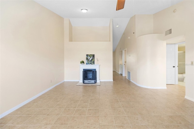 2231 Utopian Dr E Unit 307, Clearwater, FL 33763 - unfurnished living room with high vaulted ceiling, a ceiling fan, a fireplace, and light tile patterned flooring
