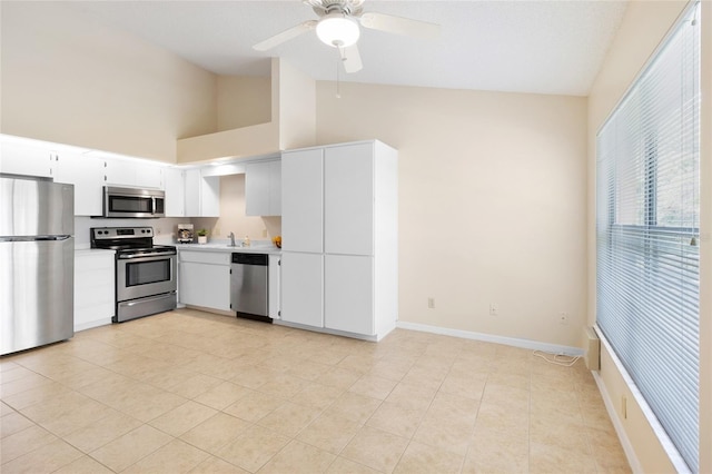 2231 Utopian Dr E Unit 307, Clearwater, FL 33763 - kitchen featuring stainless steel appliances, light countertops, ceiling fan, light tile patterned floors, and high vaulted ceiling