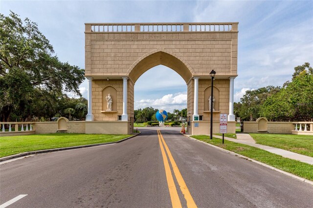 2231 Utopian Dr E Unit 307, Clearwater, FL 33763 - view of asphalt street featuring curbs, street lights, and traffic signs
