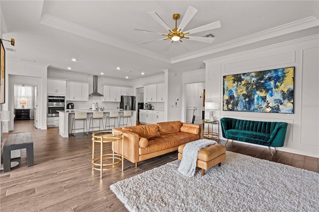 22034 Storybook Cabin Way, Land O Lakes, FL 34637 - living area with light wood-type flooring, a ceiling fan, ornamental molding, and recessed lighting
