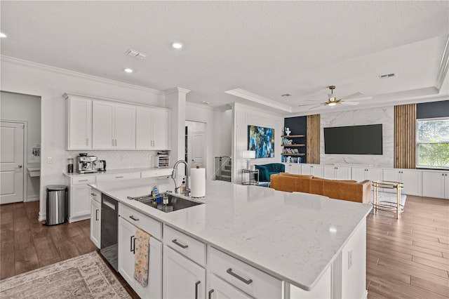 22034 Storybook Cabin Way, Land O Lakes, FL 34637 - kitchen featuring ornamental molding, dark wood-style floors, a ceiling fan, a kitchen island with sink, and dishwasher