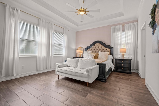 22034 Storybook Cabin Way, Land O Lakes, FL 34637 - bedroom with a raised ceiling, wood finished floors, multiple windows, and ornamental molding
