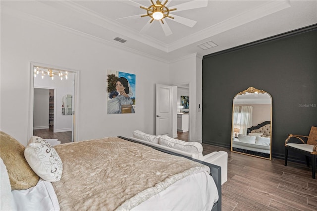 22034 Storybook Cabin Way, Land O Lakes, FL 34637 - bedroom with ornamental molding, a raised ceiling, wood finished floors, and ceiling fan