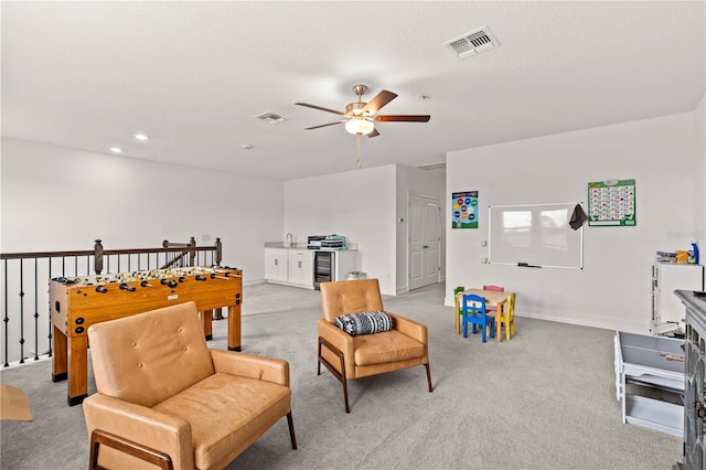 22034 Storybook Cabin Way, Land O Lakes, FL 34637 - recreation room with ceiling fan, beverage cooler, carpet, and recessed lighting
