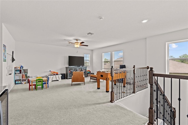 22034 Storybook Cabin Way, Land O Lakes, FL 34637 - carpeted living area with a ceiling fan