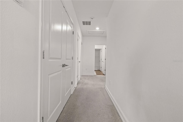 22034 Storybook Cabin Way, Land O Lakes, FL 34637 - corridor with light carpet and attic access