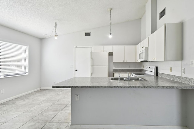 12315 Hidden Brook Dr, Tampa, FL 33624 - kitchen featuring white appliances, a peninsula, pendant lighting, a textured ceiling, and white cabinetry