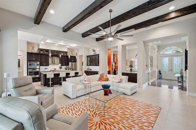 1042 Tuscany Dr, Trinity, FL 34655 - living room featuring light tile patterned floors, ceiling fan, recessed lighting, beamed ceiling, and french doors