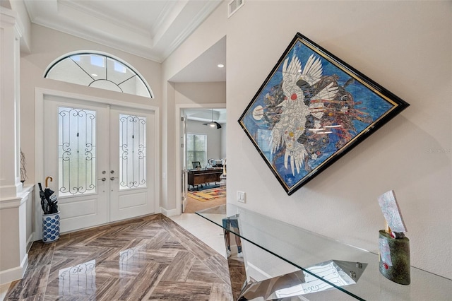 1042 Tuscany Dr, Trinity, FL 34655 - foyer entrance with french doors and ornamental molding