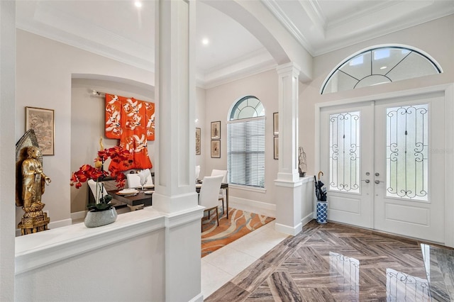 1042 Tuscany Dr, Trinity, FL 34655 - entrance foyer with arched walkways, decorative columns, ornamental molding, french doors, and recessed lighting