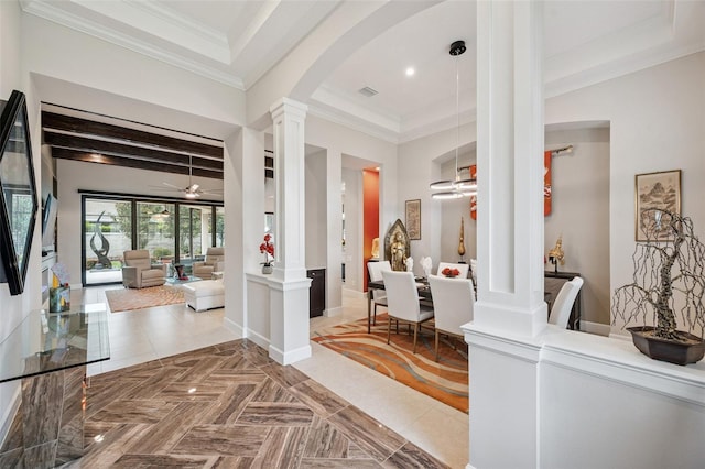 1042 Tuscany Dr, Trinity, FL 34655 - entrance foyer featuring decorative columns, arched walkways, ceiling fan, crown molding, and recessed lighting