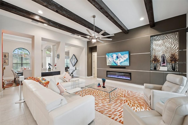 1042 Tuscany Dr, Trinity, FL 34655 - living area featuring a ceiling fan, a glass covered fireplace, tile patterned floors, recessed lighting, and beamed ceiling