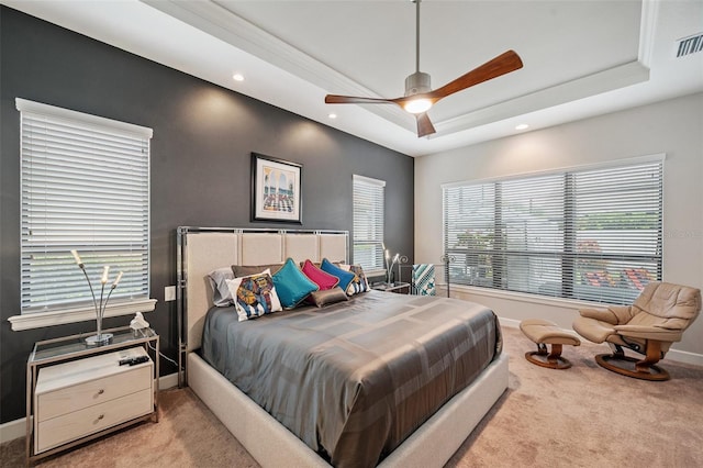 1042 Tuscany Dr, Trinity, FL 34655 - bedroom with carpet flooring, a tray ceiling, multiple windows, and recessed lighting