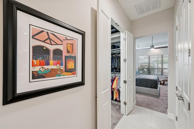 1042 Tuscany Dr, Trinity, FL 34655 - hallway with light carpet and light tile patterned floors