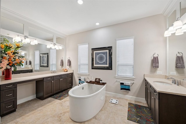 1042 Tuscany Dr, Trinity, FL 34655 - full bathroom featuring two vanities, a freestanding tub, tile patterned flooring, and recessed lighting