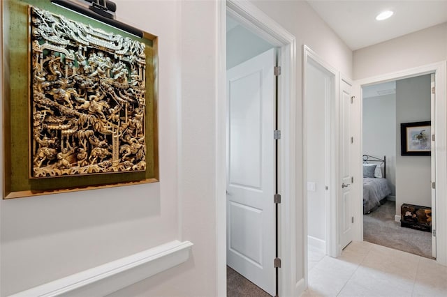 1042 Tuscany Dr, Trinity, FL 34655 - hallway featuring light carpet, light tile patterned floors, and recessed lighting