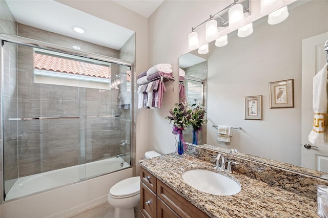 1042 Tuscany Dr, Trinity, FL 34655 - bathroom with vanity, bath / shower combo with glass door, and tile patterned flooring