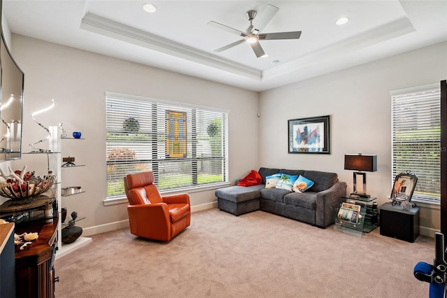 1042 Tuscany Dr, Trinity, FL 34655 - living room with crown molding, a raised ceiling, carpet flooring, a ceiling fan, and recessed lighting