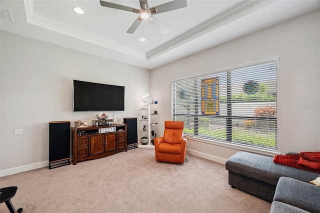 1042 Tuscany Dr, Trinity, FL 34655 - living room featuring a tray ceiling, ornamental molding, light colored carpet, a ceiling fan, and recessed lighting