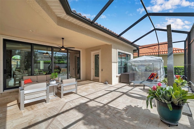 1042 Tuscany Dr, Trinity, FL 34655 - view of patio / terrace featuring a lanai, a ceiling fan, and outdoor lounge area