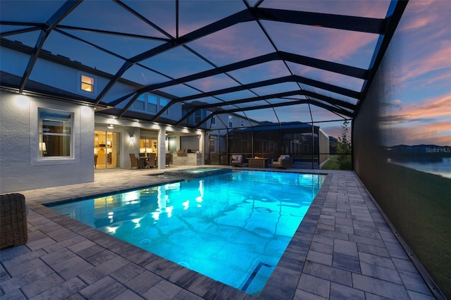 7819 Notched Pine Bnd, Wesley Chapel, FL 33545 - view of swimming pool featuring a patio, glass enclosure, and a pool with connected hot tub