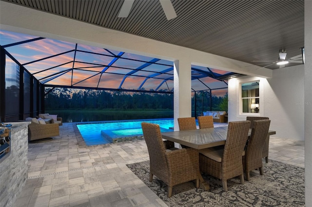 7819 Notched Pine Bnd, Wesley Chapel, FL 33545 - view of patio featuring ceiling fan, an outdoor hangout area, and glass enclosure