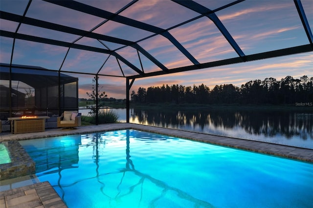 7819 Notched Pine Bnd, Wesley Chapel, FL 33545 - view of swimming pool featuring a water view, a patio area, a pool with connected hot tub, and glass enclosure
