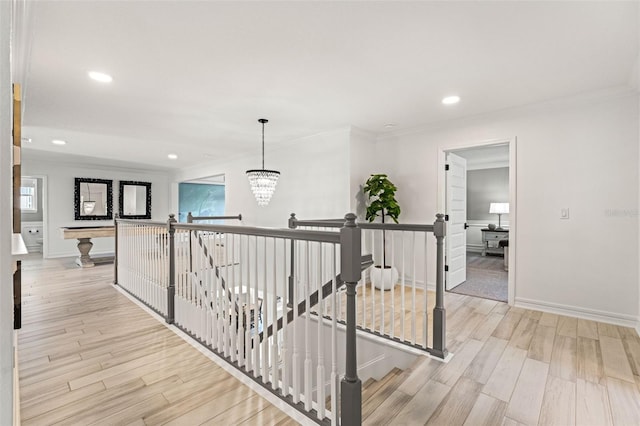 7819 Notched Pine Bnd, Wesley Chapel, FL 33545 - hallway with an upstairs landing, crown molding, light wood-style flooring, a chandelier, and recessed lighting